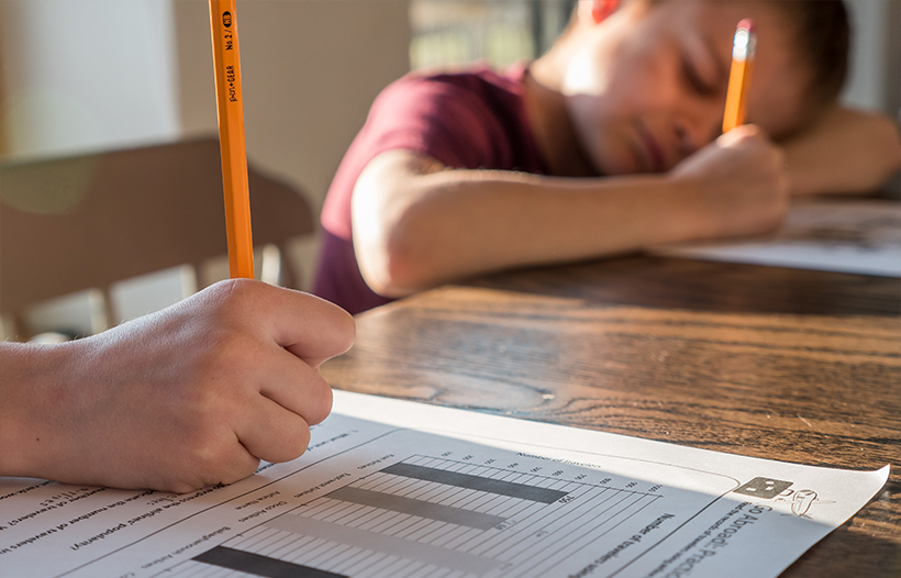 Children doing homework at kitchen table