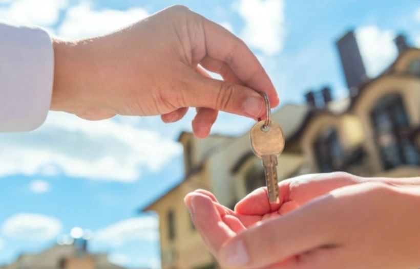 Estate Agent handing over keys