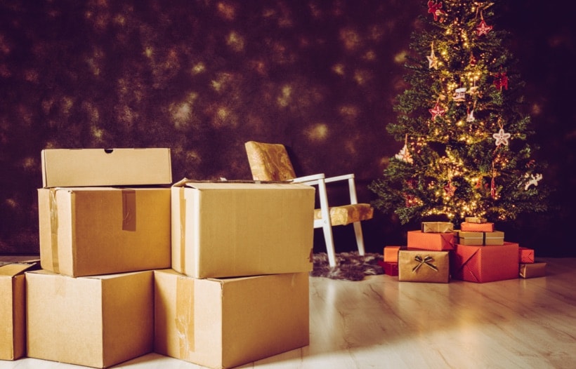 Cardboard boxes in front of Christmas tree