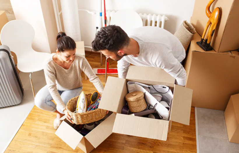 Couple unpacking boxes