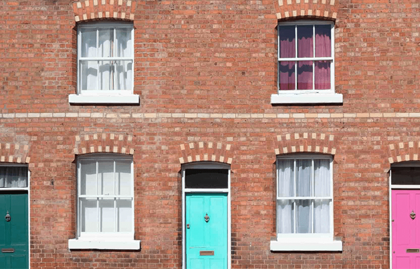 Front exterior of terraced hourse with coloured doors