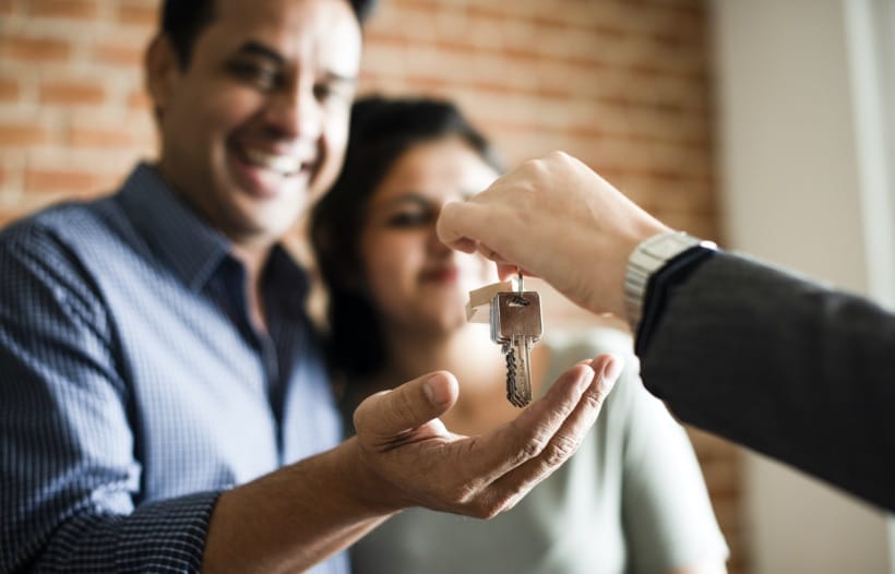Couple receiving new set of keys