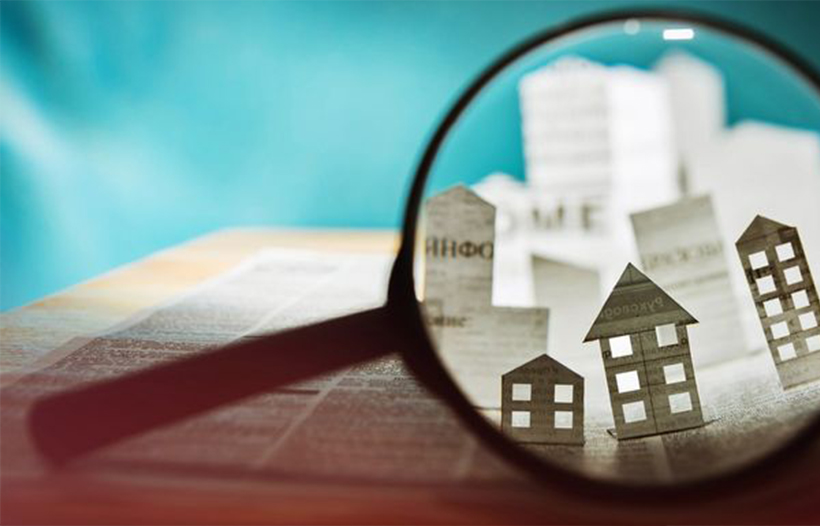 Magnifying Glass viewing property newspaper cut-outs