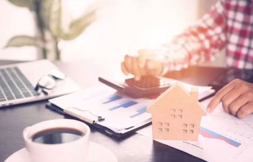 Person calculating mortgage payments