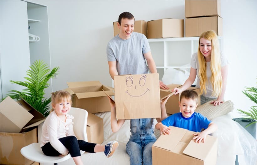 Family unpacking boxes