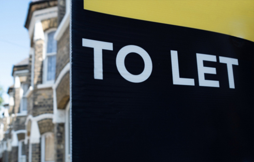 To Let property board outside house