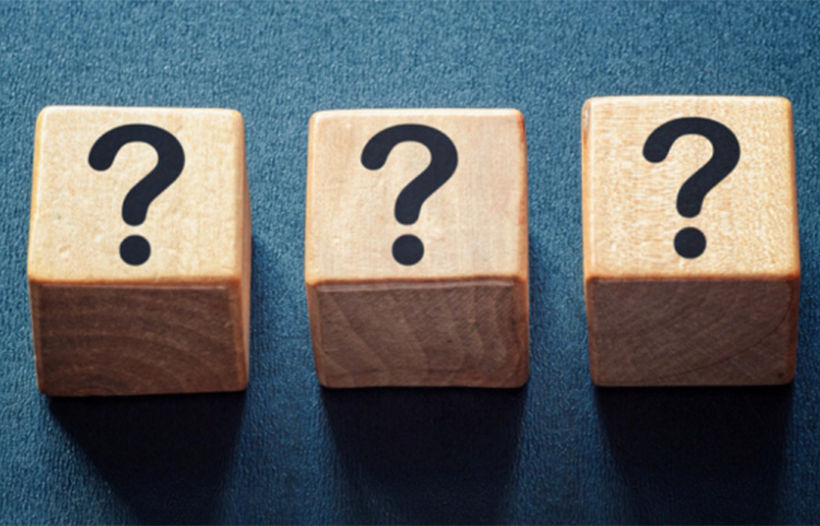 Row of dice containing question marks