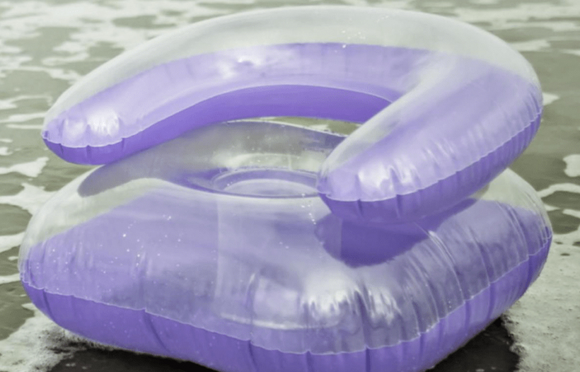 Inflatable blowup chair on beach