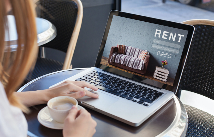 Lady at café looking at laptop (Macbook)