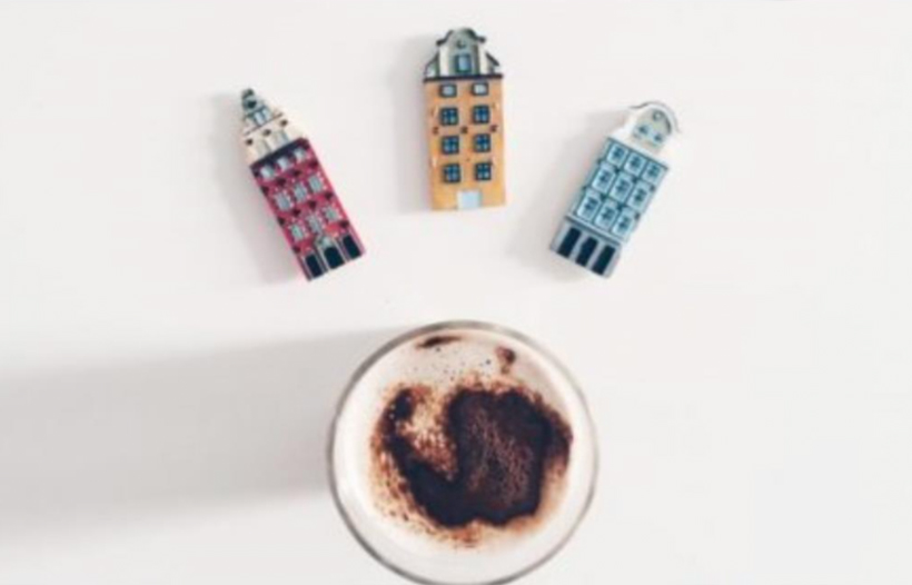 Condiments and a cup of cappuccino