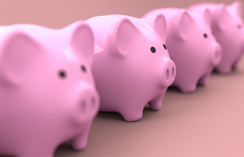 Row of money piggy banks