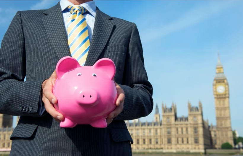 Financial advisor holding money piggy bank