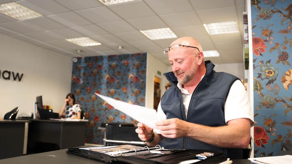 Pocock + Shaw agent reviewing property details