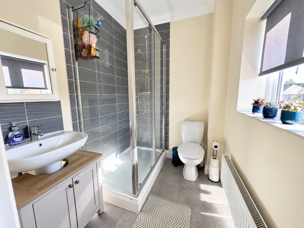 Naturally brightened bathroom with blue pots